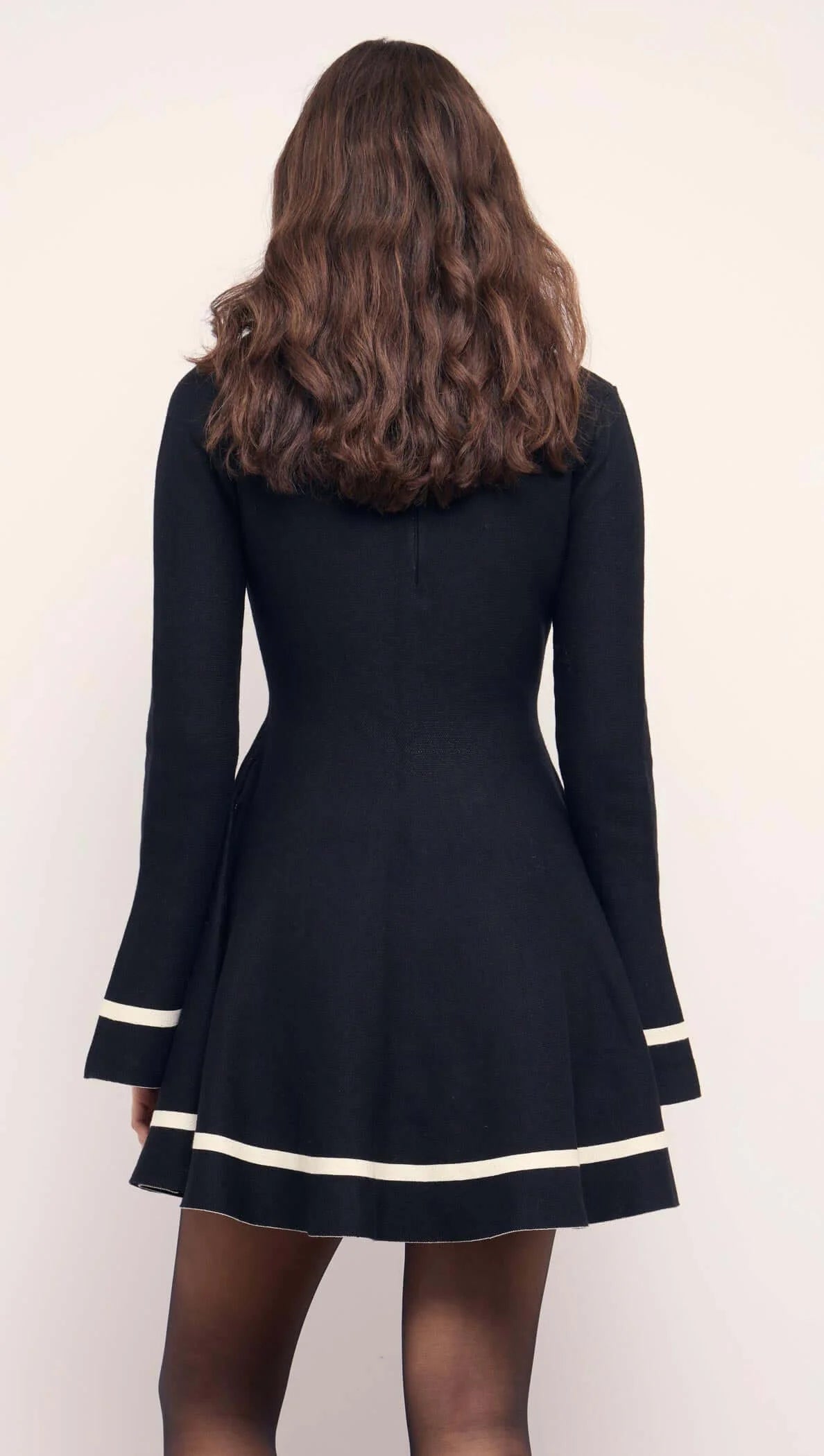 BLACK PEPLUM KNIT MINI DRESS WITH CONTRACT TRIM